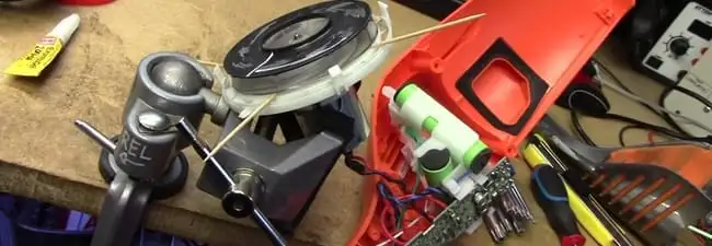 Vacuum cleaner repair parts and tools on a workbench in Santa Ana, CA